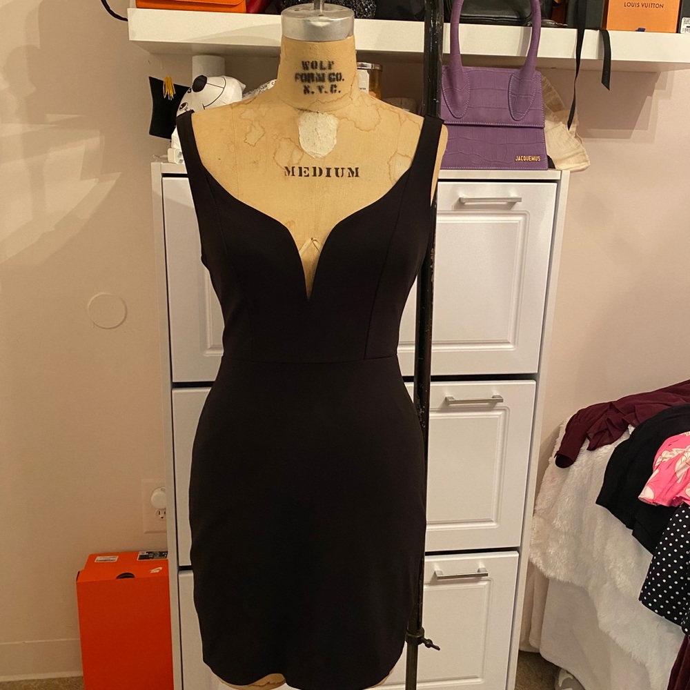 Black mini dress and v cut neckline